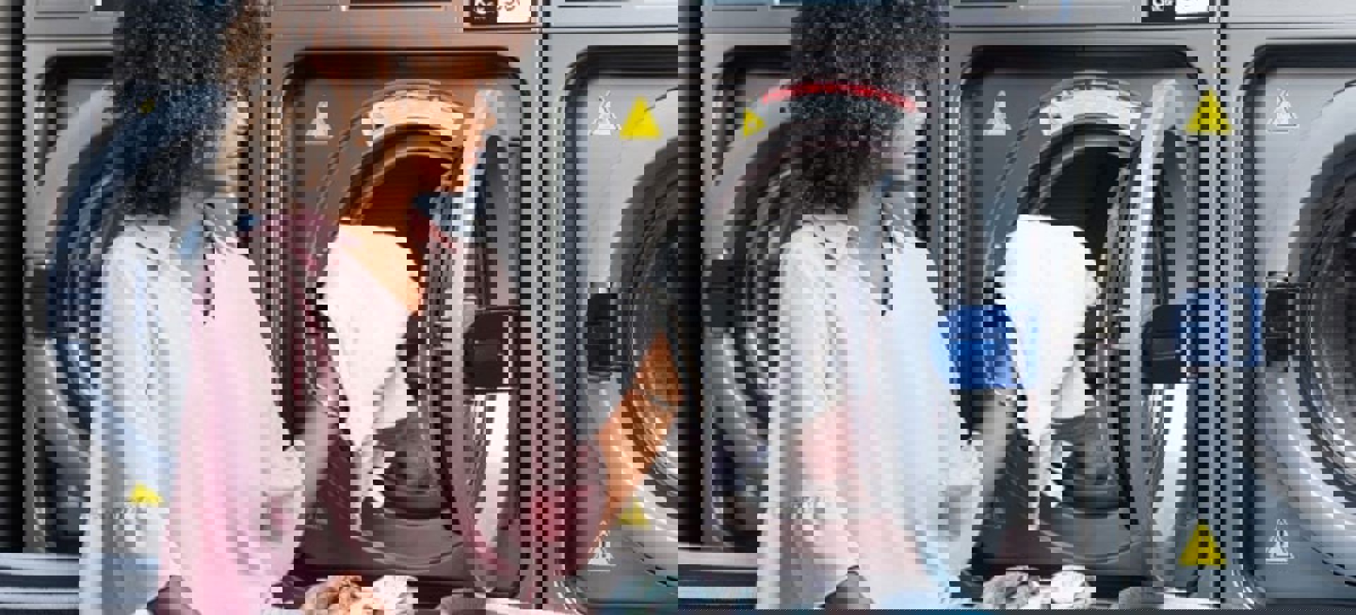 Woman Loading Washing Machine At Laundromat Min 1
